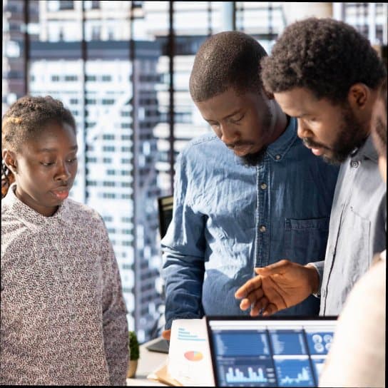 Members reviewing figures together at a branch desk.